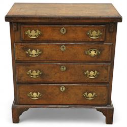 Mid-19th-century Georgian-style burr walnut bachelor's chest with feather-banding, hinged rectangular brushing slide above four graduated long drawers with brass batwing handles and escutcheons, raised on bracket feet  