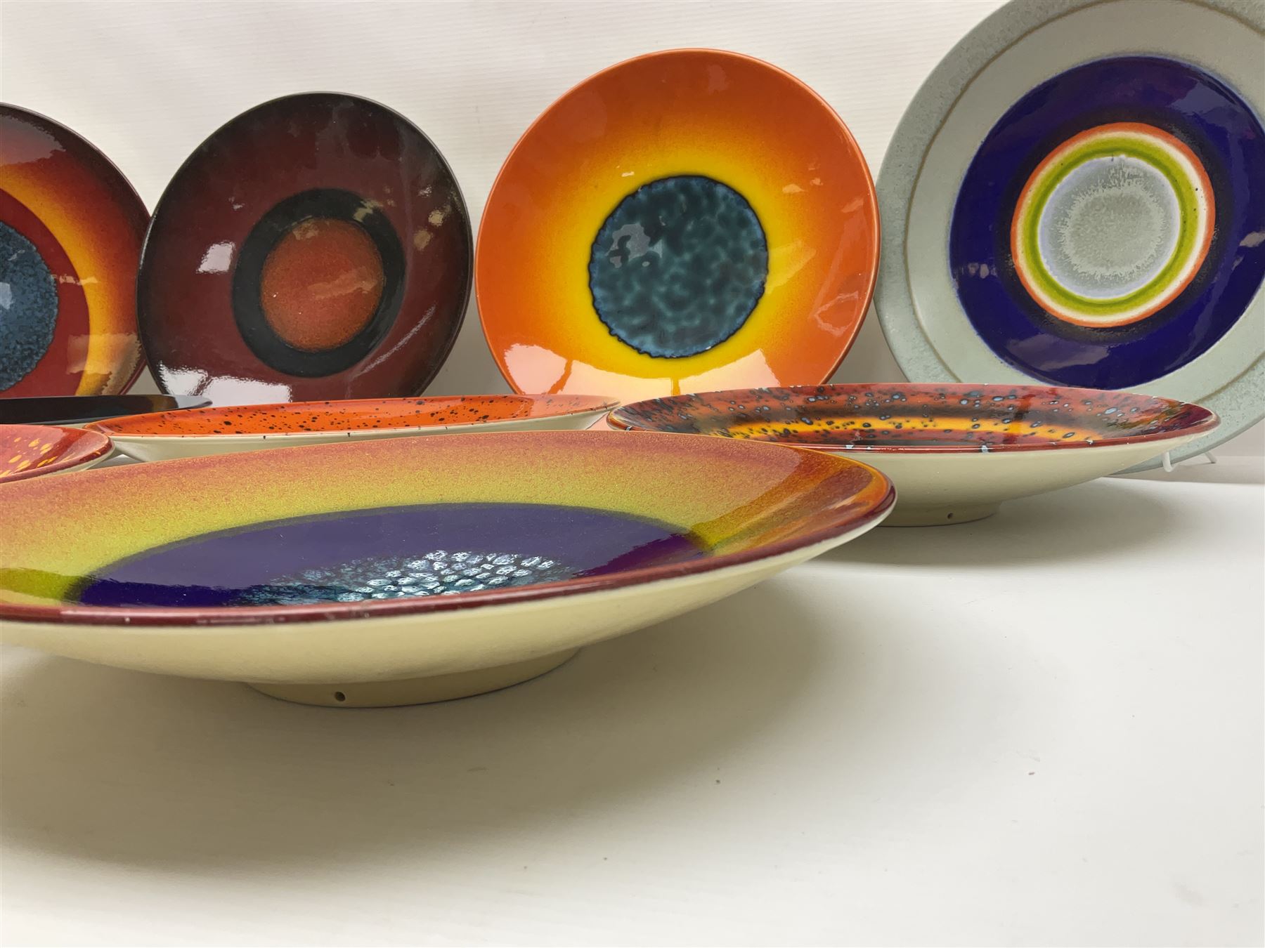 Poole Pottery The Planets, set of nine chargers 'The Planets, by Alan Clarke, comprising Mars, Mercury, Neptune, Venus, Uranus, Pluto, Jupiter, Saturn and Earth, all with original boxes and certificate, D27cm 