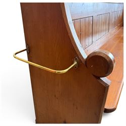 Early 20th century stained pine ecclesiastical church pew, the shaped end supports flanking slatted and panelled back, with black stencilled number '16' to the side