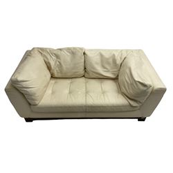 Roche-Bobois - two seat sofa, upholstered in ivory leather with buttoned seat cushions, raised on a stained beech base with bracket feet