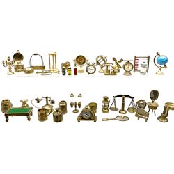 Over one-hundred various scale miniature brass ornaments suitable for decorating doll's houses including assorted lamps, fire-side tools and accessories, clocks, pans, scales, bottle holder, abacus, grand piano, ship's binnacle, wheel and telegraph, hour glass, miner's lamp etc
