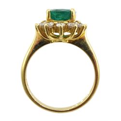Gold oval emerald and diamond cluster ring, stamped 18K, emerald approx 1.60 carat