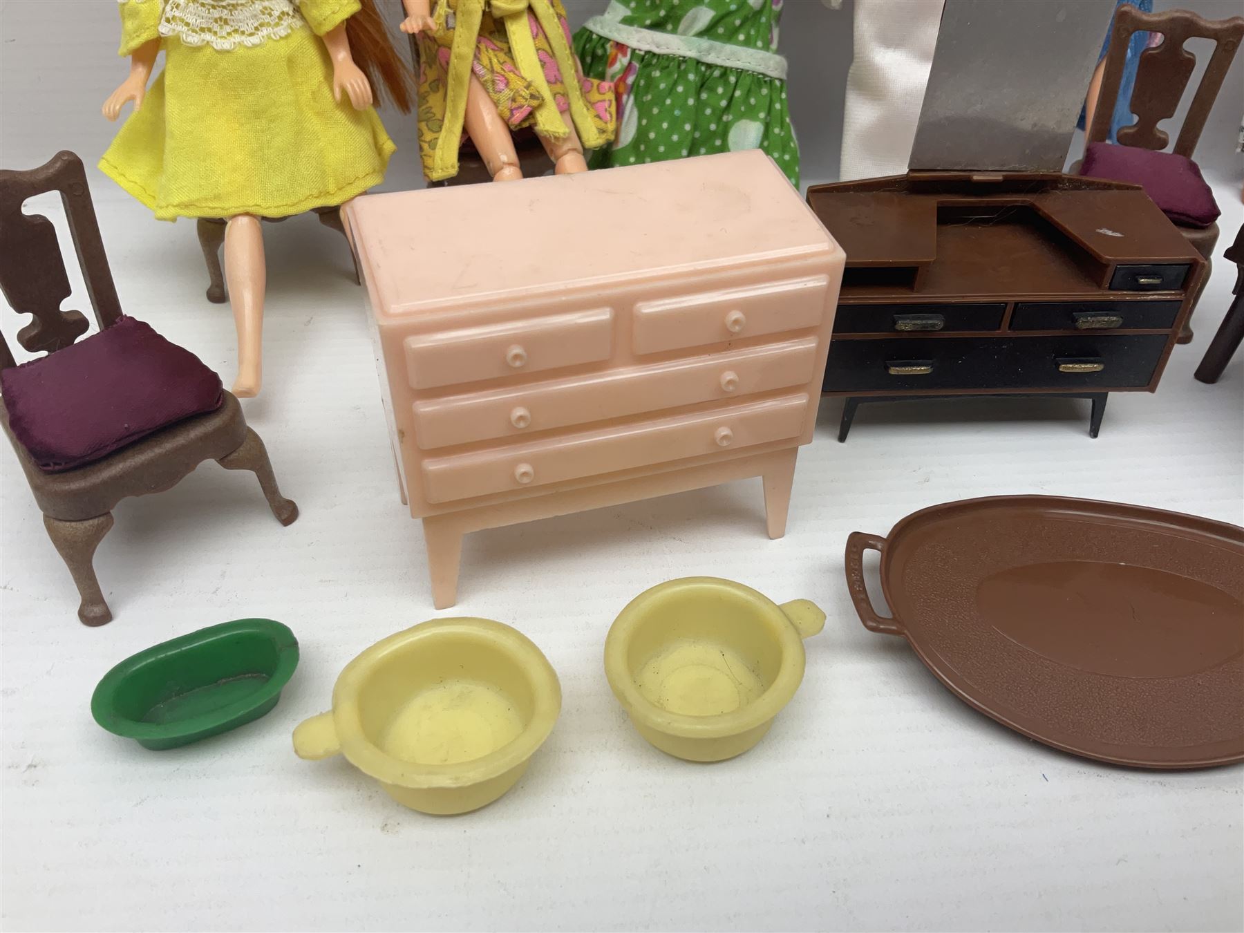 Seven Pippa dolls and a collection of plastic dolls house furniture