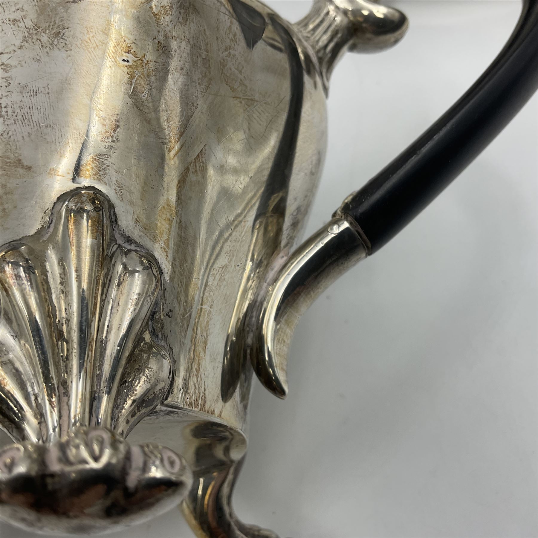 Five piece Edwardian silver tea service, comprising teapot and coffee pot, each with ebonised scroll handle, tea caddy with hinged cover, twin handled open sucrier, and milk jug, each of rounded bombe form, upon four paw feet, hallmarked William Adams Ltd, Birmingham 1904 and 1905, coffee pot H26cm
