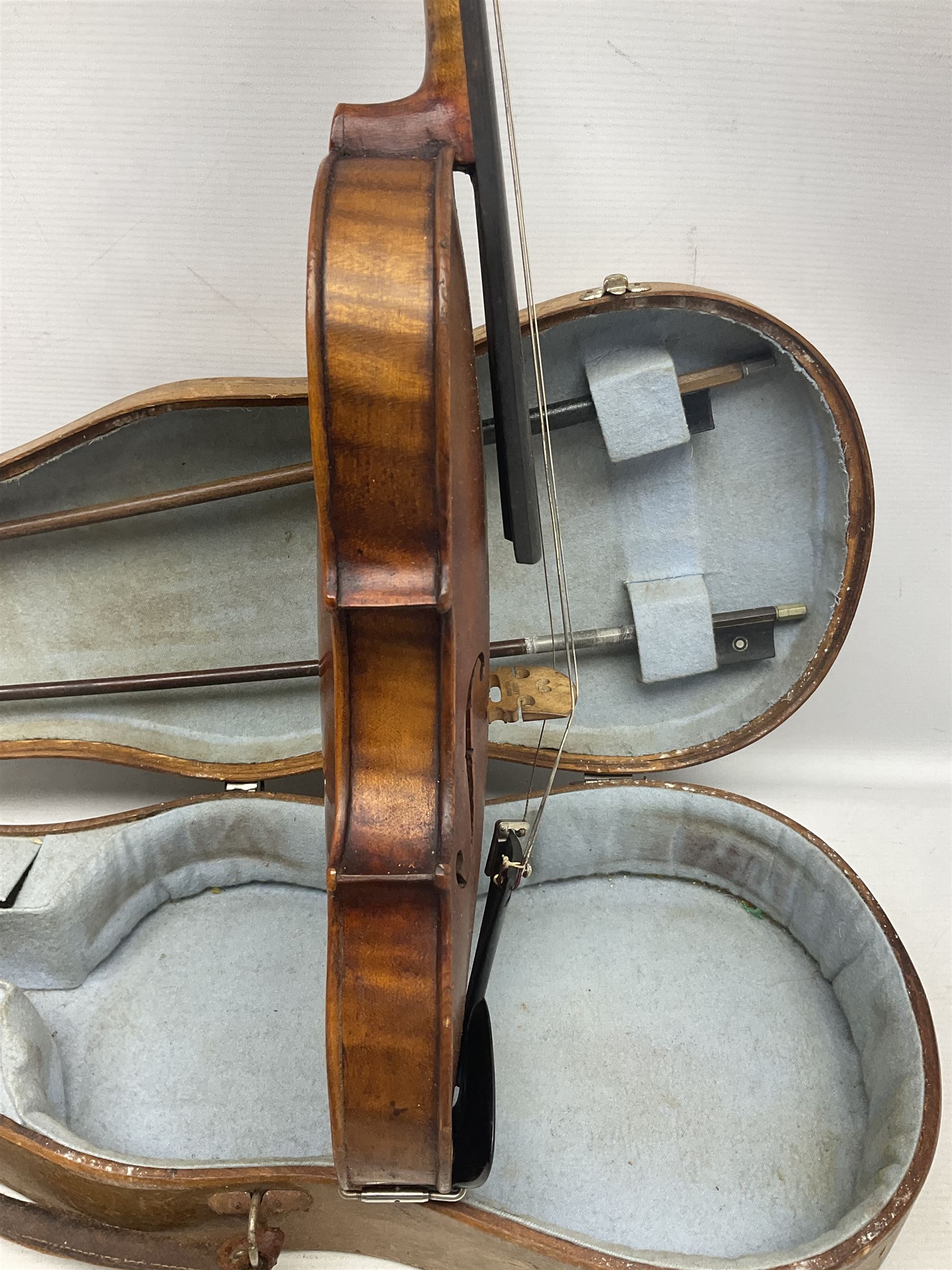 Mid-19th century German violin with 36cm two-piece maple back and ribs and spruce top, bears label 'Riccardo Antoniazzi Cremonese fece in Milano l'anno 1896' L59.5cm overall; in walnut case with two part bows