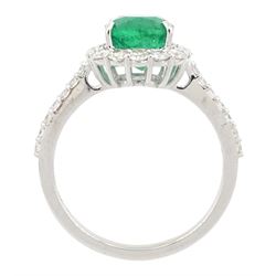 18ct white gold cushion cut emerald and round brilliant cut diamond cluster ring, with diamond set shoulders, stamped, emerald approx 2.30 carat
