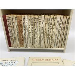 'Peter Rabbit's Book Shelf', containing selection of Beatrix Potter books, mostly library editions, shelf H29cm L27.5cm D11.5cm