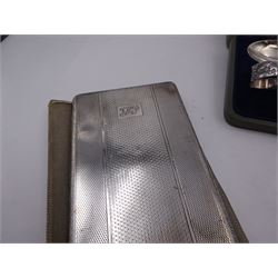 Mid 20th century silver cigarette case, of rectangular form with rounded corners, with engine turned decoration and engraved monogram to cover, hallmarked E & J Leek, Birmingham 1947, together with a smaller early 20th century silver cigarette case, with engraved floral and scrolling decoration, hallmarked Arthur Barnett & Co Ltd, Birmingham 1911, a 1920s silver spoon and pusher with embossed Punch and Judy decoration, hallmarked Levi & Salaman, Birmingham 1921, in fitted case, and an unmarked white metal propelling pencil, with hardstone seal