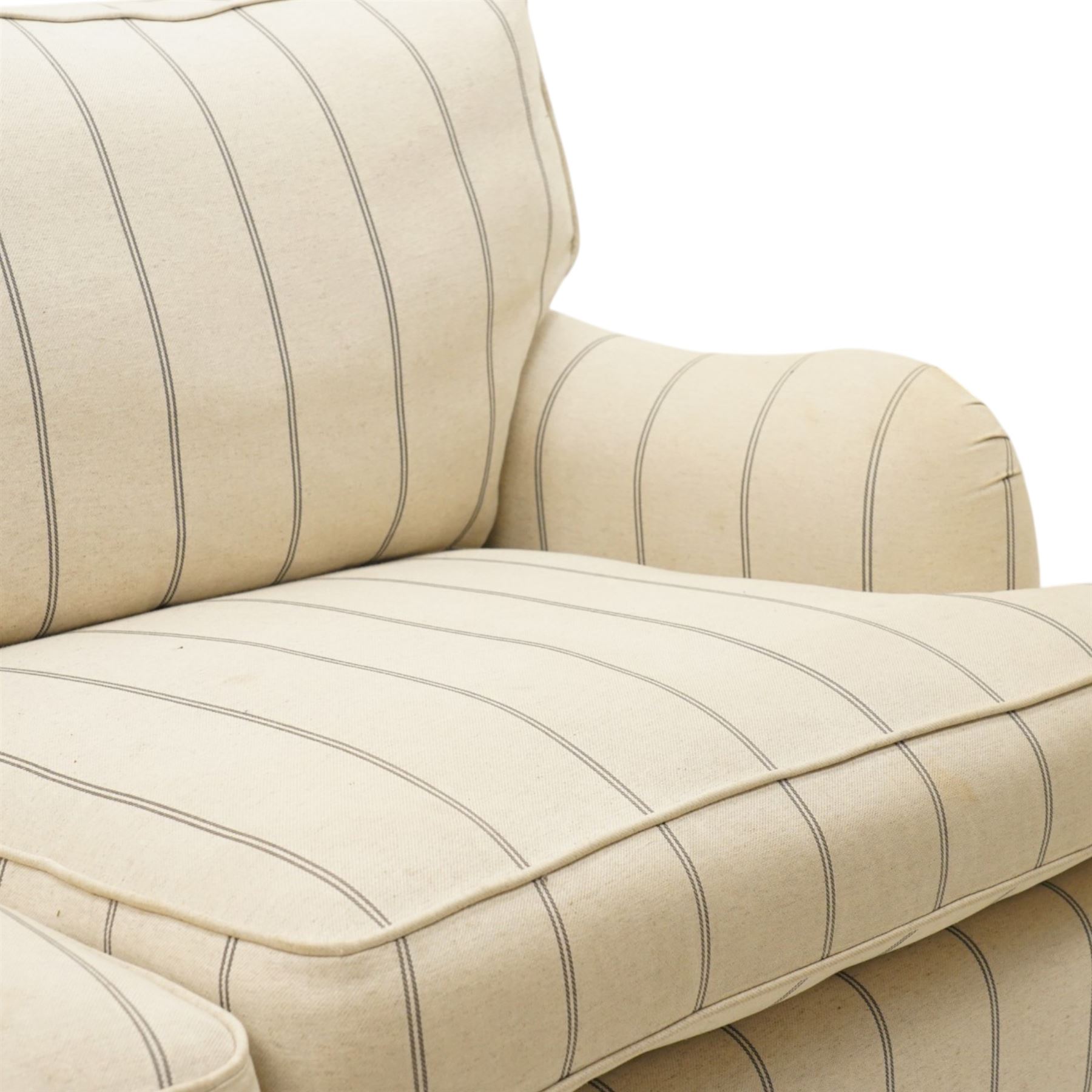 20th century Howard shape two seat sofa, deep seat sofa in cream and grep striped upholstery, raised on dark supports terminating in front castors 