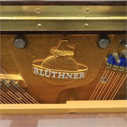 Bluthner of Leipzig upright piano, mahogany case with 88 keys and three brass pedals