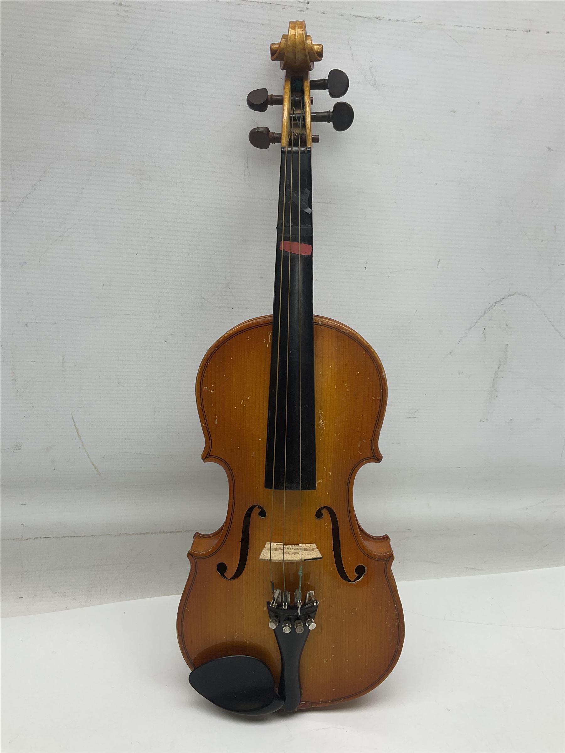 Four Chinese graduated violins - full size with 35.5cm two-piece back; three-quarter size with 33.5cm two-piece back; half size with 31cm two-piece back; and quarter size with 27.5cm two-piece back; all cased except full size; one with bow (4)