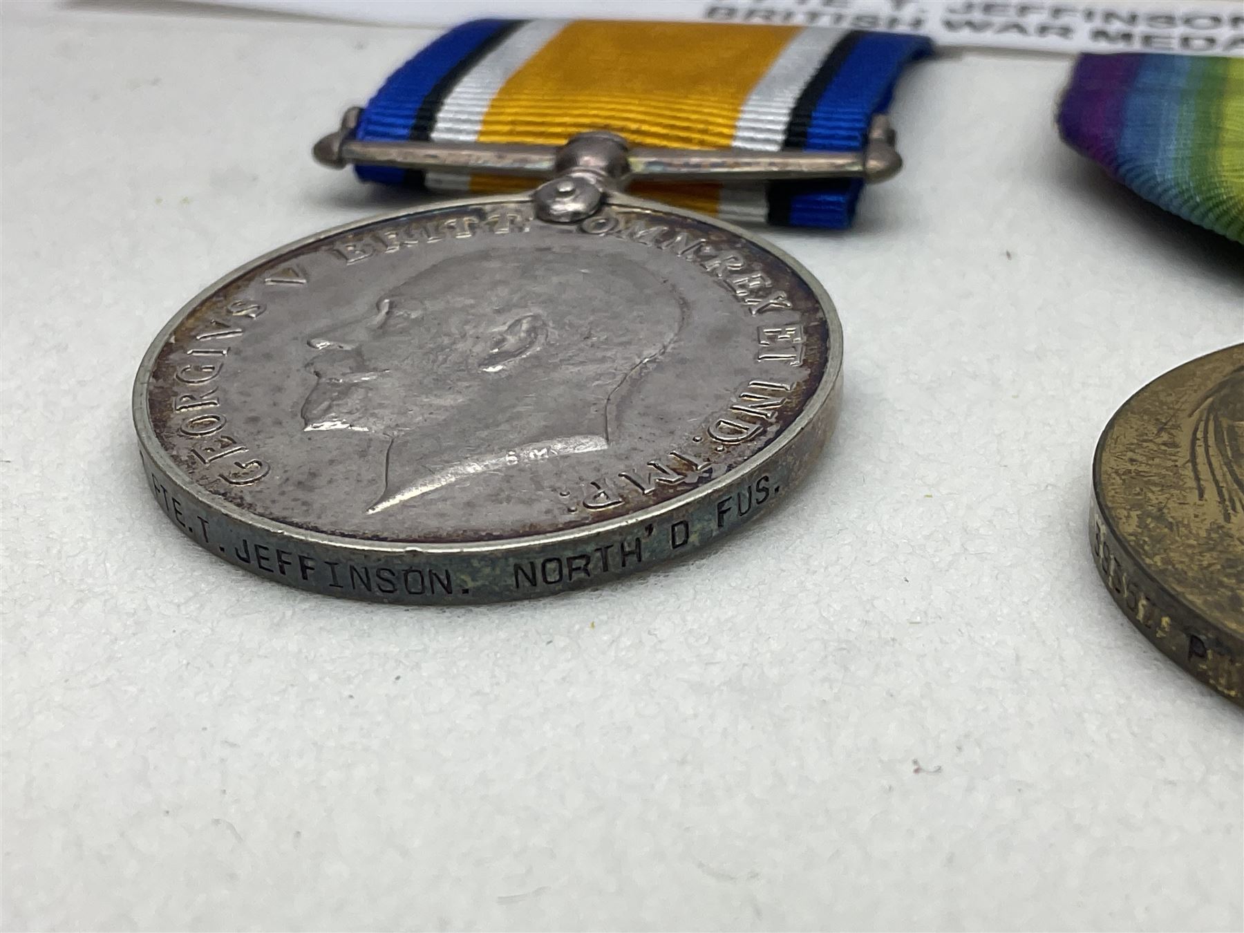 WWI pair of medals comprising British War Medal and Victory Medal awarded to 39357 Pte. T. Jeffinson Northumberland Fusiliers; both with ribbons (2)
