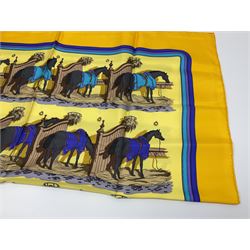 Hermès 'Ecuries' silk scarf, designed by Hugo Grygkar in 1947, printed with twenty horses in their respective stables, on yellow ground contained within stitched effect blue and purple and darker yellow gold borders, with rolled hand stitched edges and Hermes material label, 87cm square