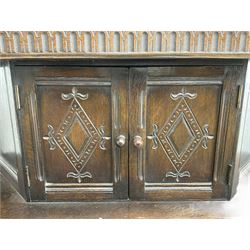 20th century oak court cupboard, arcade carved frieze over baluster supports with demi-hexagon cupboard with lozenge carved facias, the base fitted with two drawers over double cupboard, each with heavily moulded edges