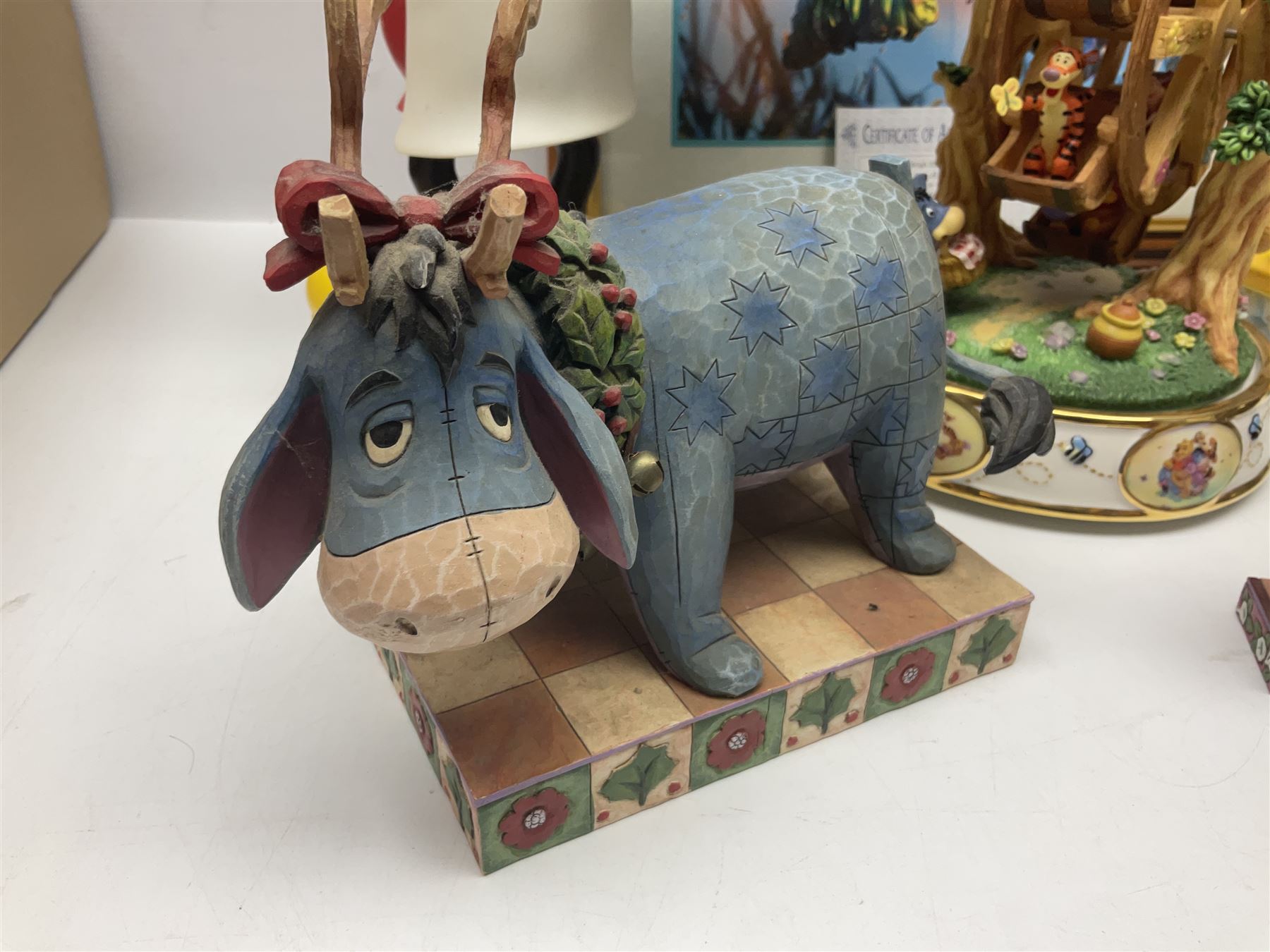 Collection of Disney figures, to include Ardleigh Elliott music box Hunny of the Day, Disney musical snow globe, Micky mouse lazy butler, Framed Bug's Life lithograph etc 