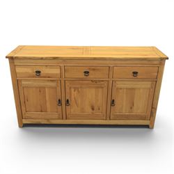 Contemporary oak sideboard, with rectangular top above three drawers and three cupboard doors, blackened metal handles, raised on stile supports