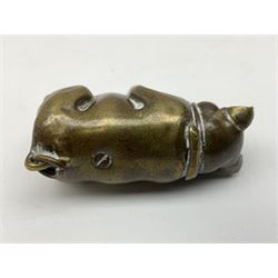 Victorian novelty brass vesta case modelled in the form of a pig holding a money bag, together with a silver vesta, hallmarked 