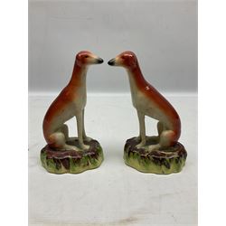 Pair of Staffordshire style seated greyhounds, H20cm