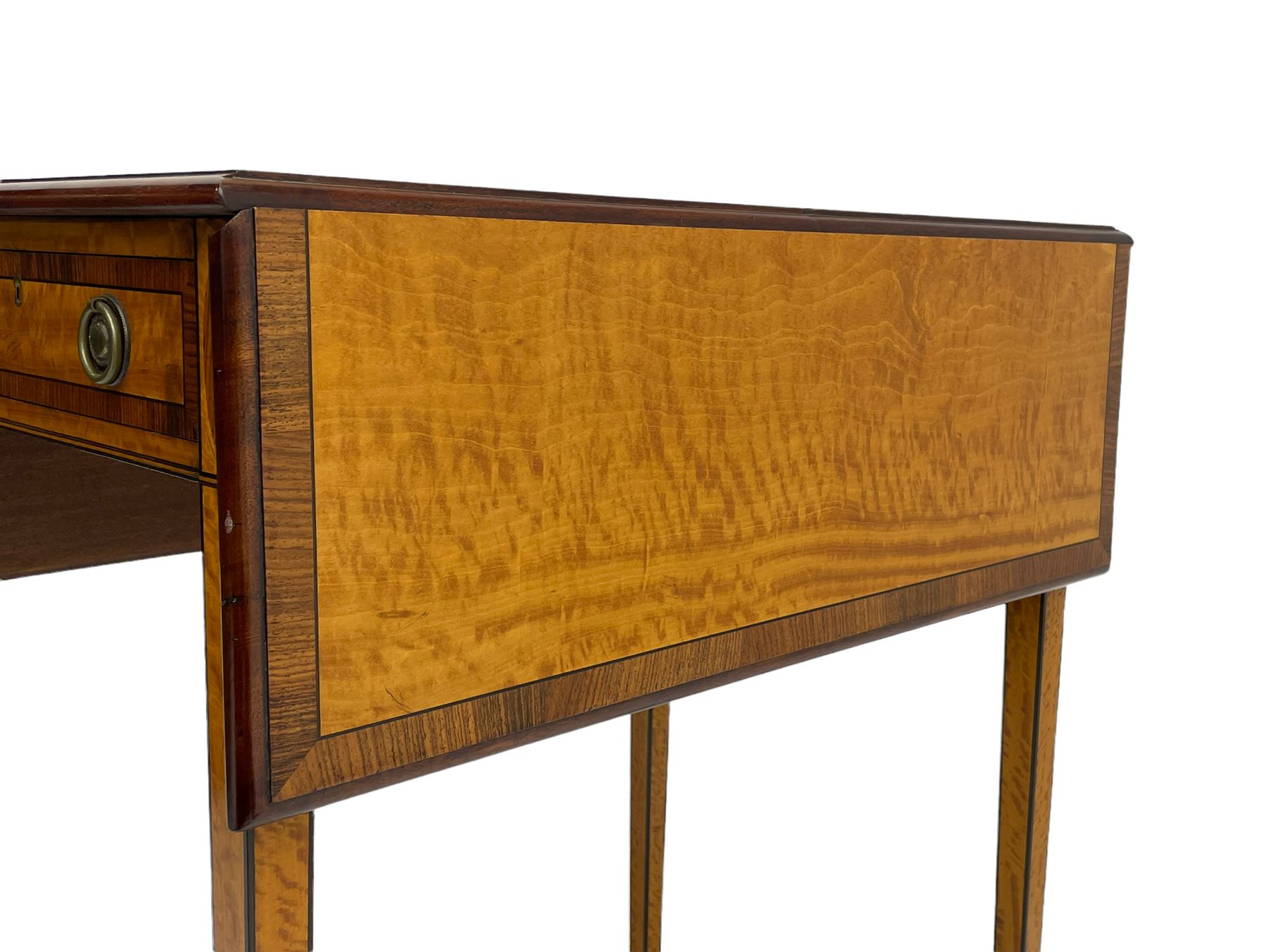 Mid-to-late 20th century Sheraton style satinwood Pembroke table, the drop leaf top with segmented veneers and central oval panel with ebony stringing, crossbanded in rosewood and with edge moulding, single short drawer to one end and faux drawer to other, square tapering supports