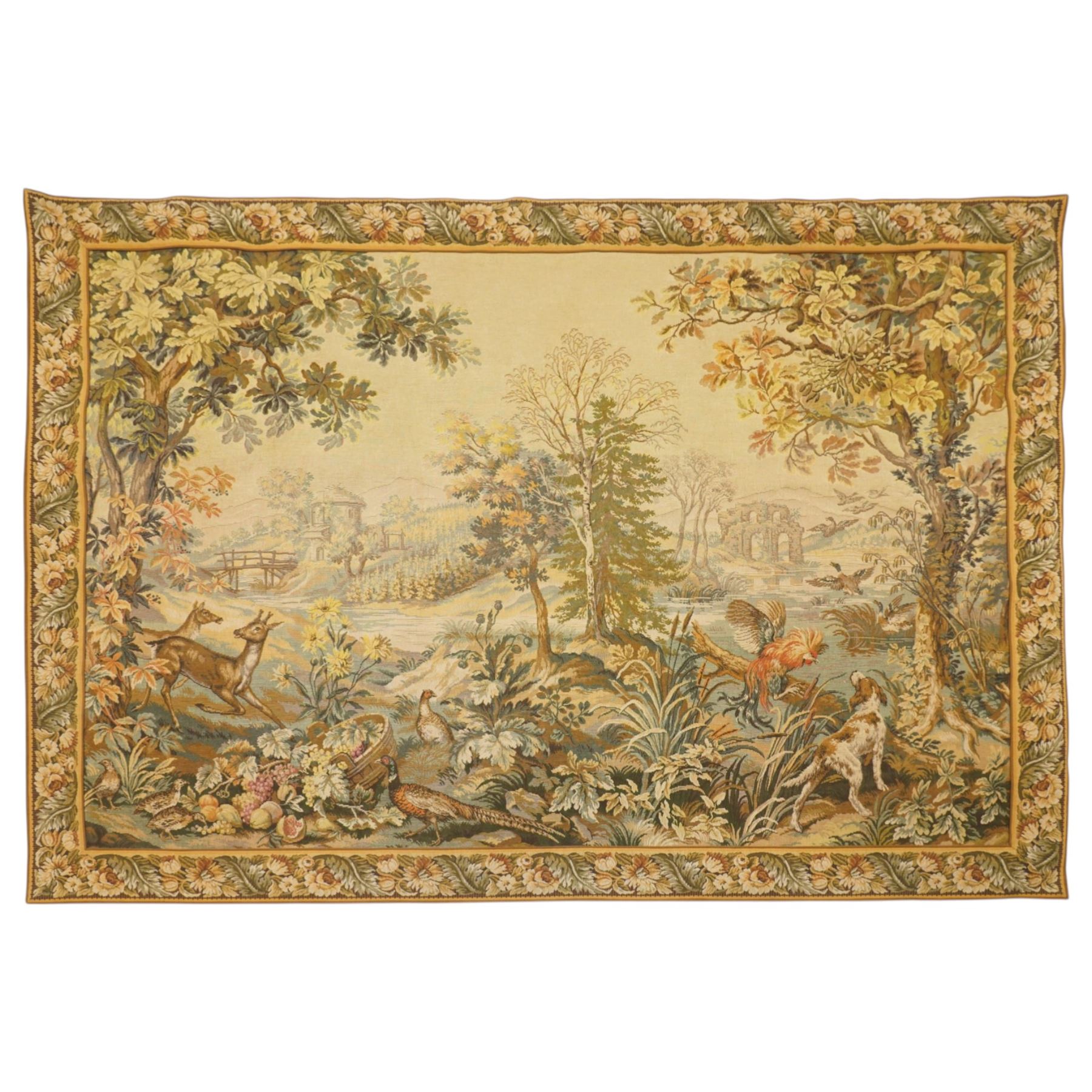 Large French Aubusson style verdure tapestry, of 18th century design but later, depicting a country landscape and ruins with hunting prey to foreground, 153cm x 212cm