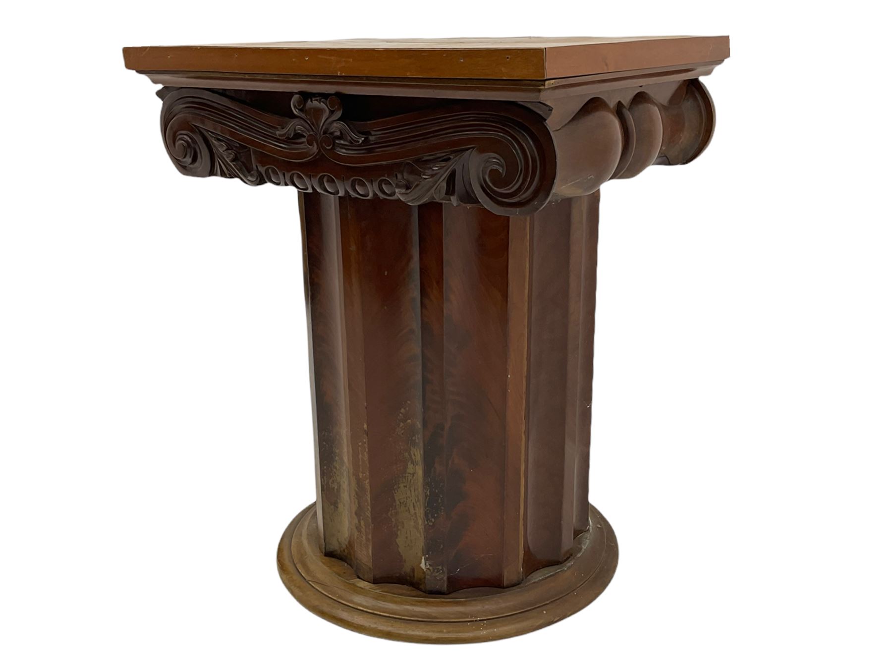 Victorian mahogany vanity unit in the form of a column, the scrolled top with hinged lid revealing mirror, wash bowl and toiletry dishes, on scalloped cylinder pedestal with single door, the interior fitted with shelf
