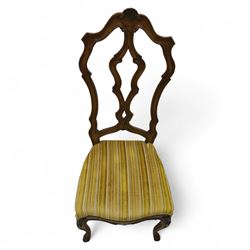 20th-century set of four French provincial-style stained beech dining chairs, pierced cartouche back with fan carving, with a scroll moulded frame above a padded serpentine seat on cabriole legs 