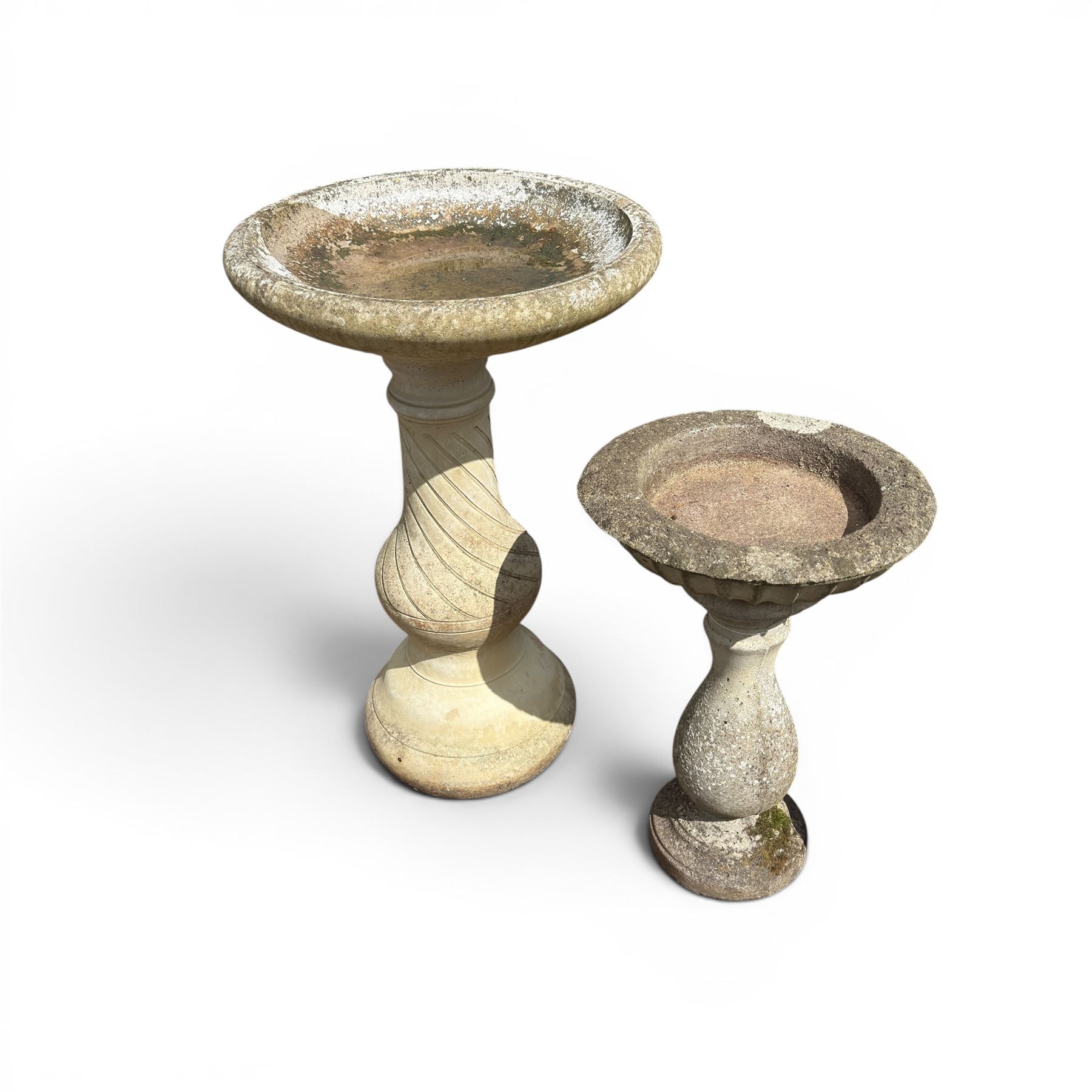 Large cast stone bird bath, circular bowl on spiral column; and a small three piece bird bath (2)