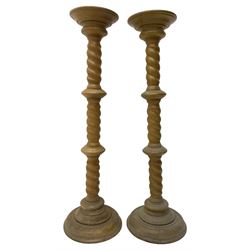 Pair of Victorian design light oak torcheres or jardinieres, circular top with raised lip over a spiral turned column terminating in circular turned plinth base