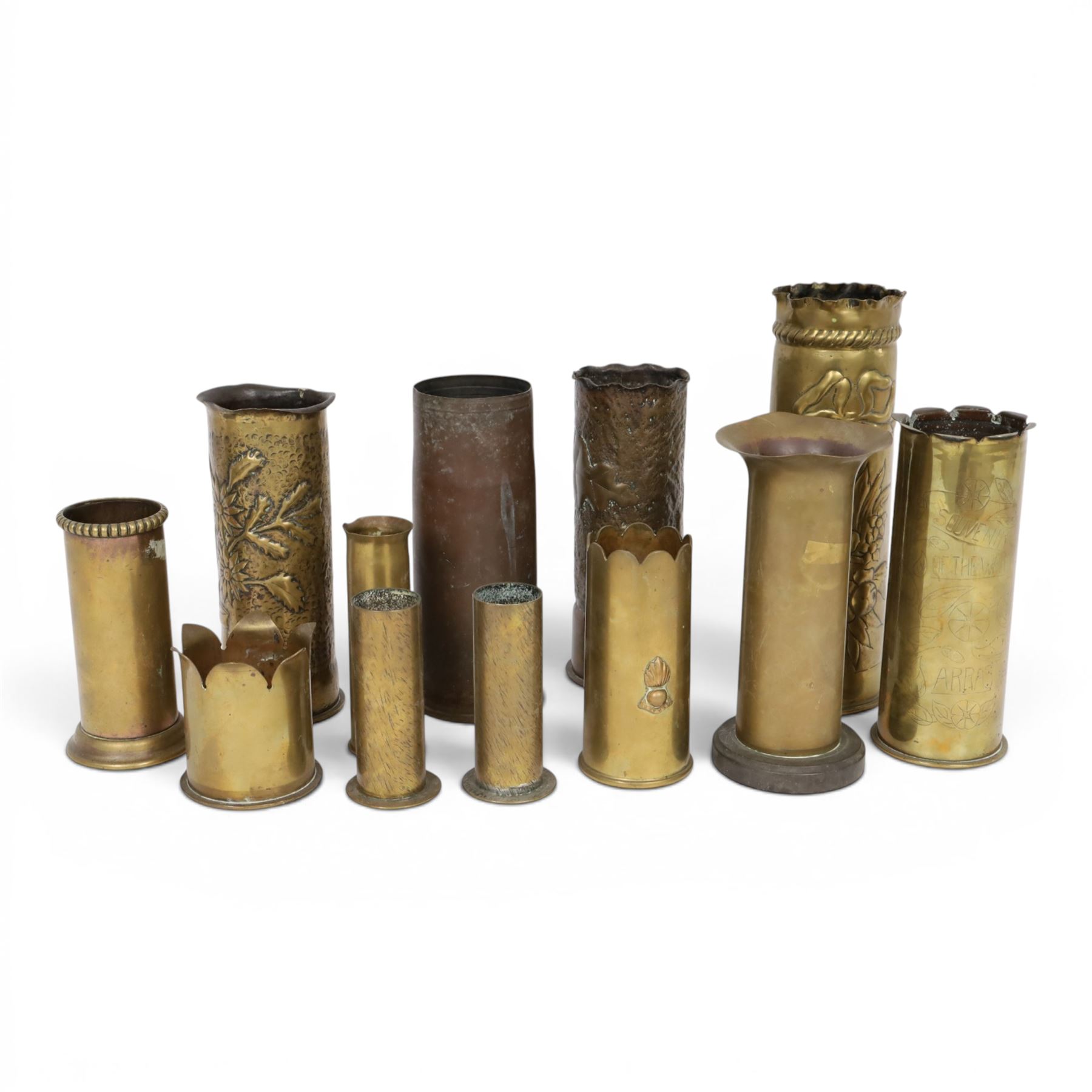 Eleven tench art shell case vases, including examples decorated in relief, with flowers, largest H30cm