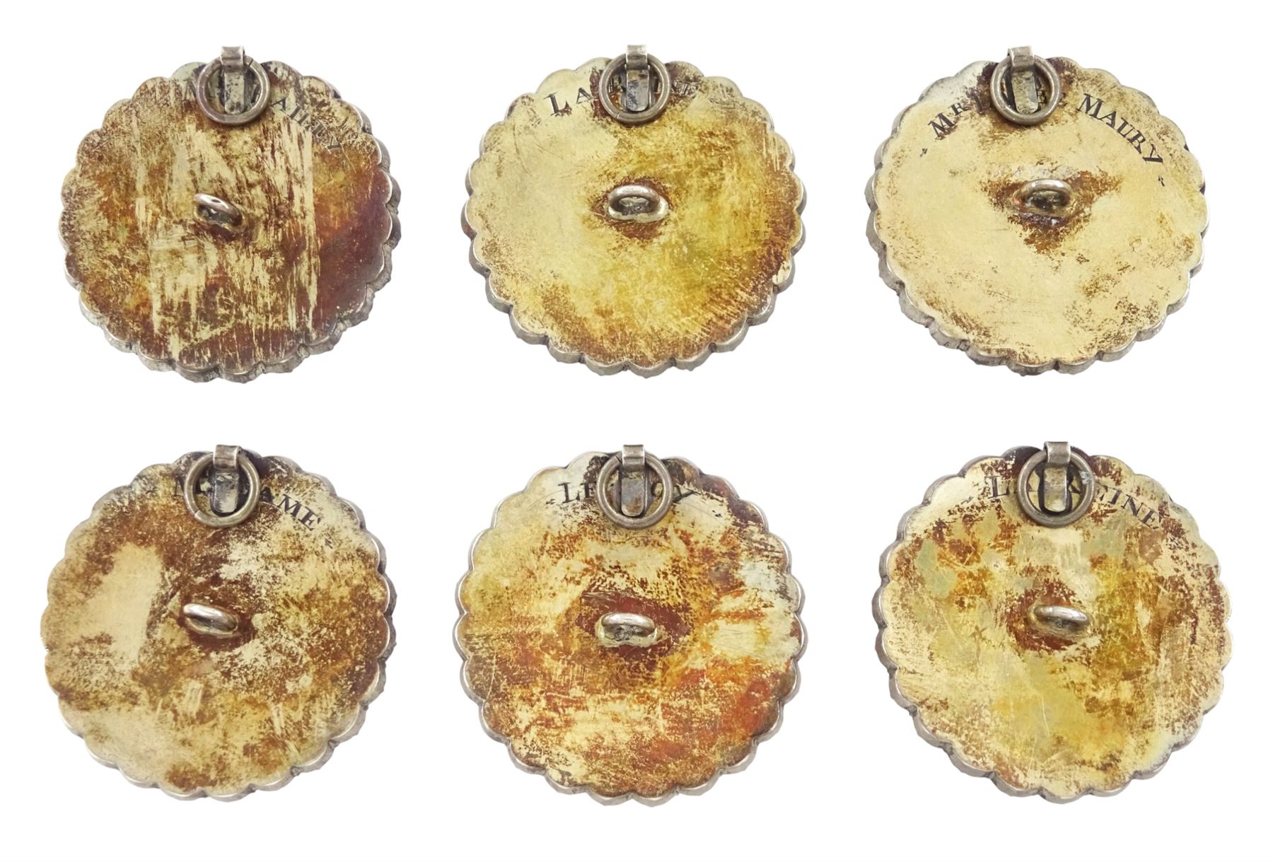 Set of six late 18th century French portrait miniature buttons, each finely painted upon ivory with a likeness of notable figures of the French Royal Court, set under glazed panels within silver frames mounted with paste stones, engraved verso with the sitters’ names and fitted with eyelets, later adapted with suspension rings; comprising “LE ROY” (Louis XVI), “LA REINE” (Marie Antoinette, youth portrait), “LA REINE” (Marie Antoinette, mature portrait), “MADAME” (Maria Josepha of Savoy, 1771–1810, wife of Louis, Comte de Provence, later King Louis XVIII), “M. BAILLY” (Jean Sylvain Bailly, 1736–1793, Mayor of Paris), and “M. L’ABBÉ MAURY” (Jean-Siffrein Maury, 1746–1817, Cardinal and Archbishop of Paris), overall D3.5cm. This lot has been registered for sale under Section 10 of the APHA Ivory Act