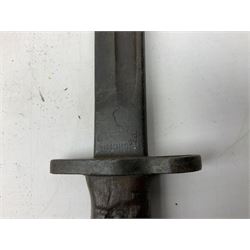 British Pattern 1907 bayonet with 43.5cm fullered steel blade; in leather scabbard with webbing frog L58cm overall; another Pattern 1907 bayonet lacking scabbard; and British Pattern 1888 Mk.I bayonet by Wilkinson London (no scabbard) (3)