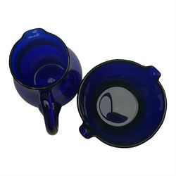 19th century Bristol blue glass jug, the baluster body with simple loop handle, together with a double lipped rinser, jug H14cm