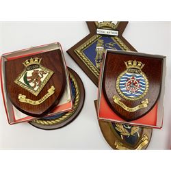 Various Navy wooden heraldic shields each with hand painted raised shield, including HMS Indefatigable, HMS Nelson,  HMS Victory etc, ten in total.  