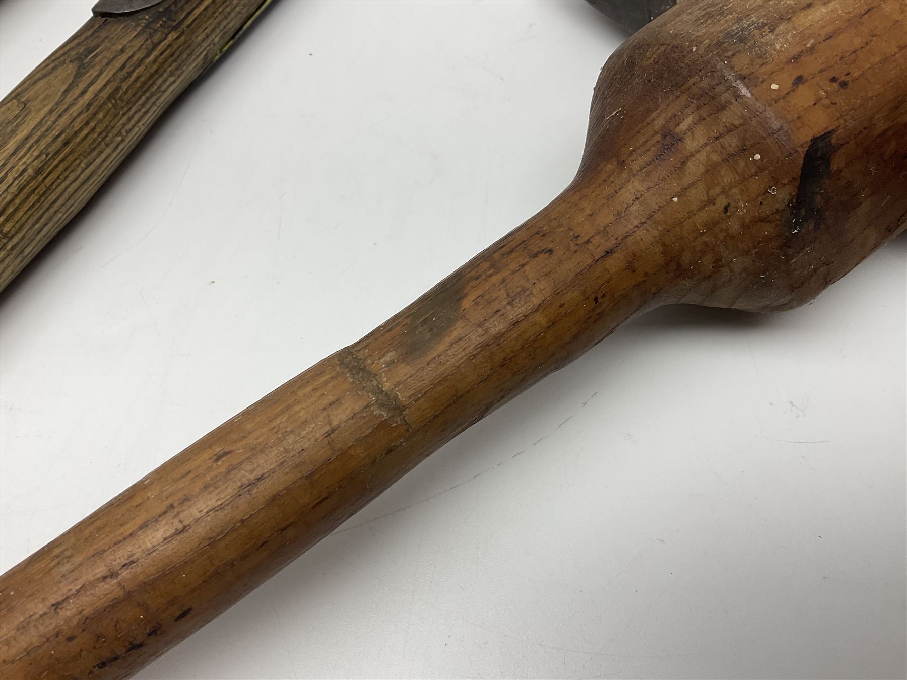 Post-War military type fireman's axe impressed 'PERKS 1953/54' with additional indistinct mark probably WD arrow, ash handle L39cm; and another stonemason's(?) double headed axe with mallet shaped shaft (2)