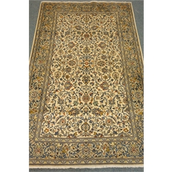 Persian Kashan beige ground rug with floral and foliate field, 224cm x 140cm  