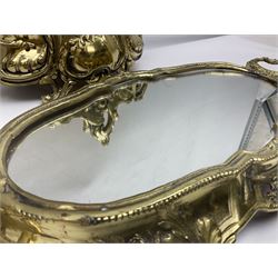 Ornate brass centrepiece, with twin handled vase upon a mirrored base, with floral and scrolling decoration, H23cm 