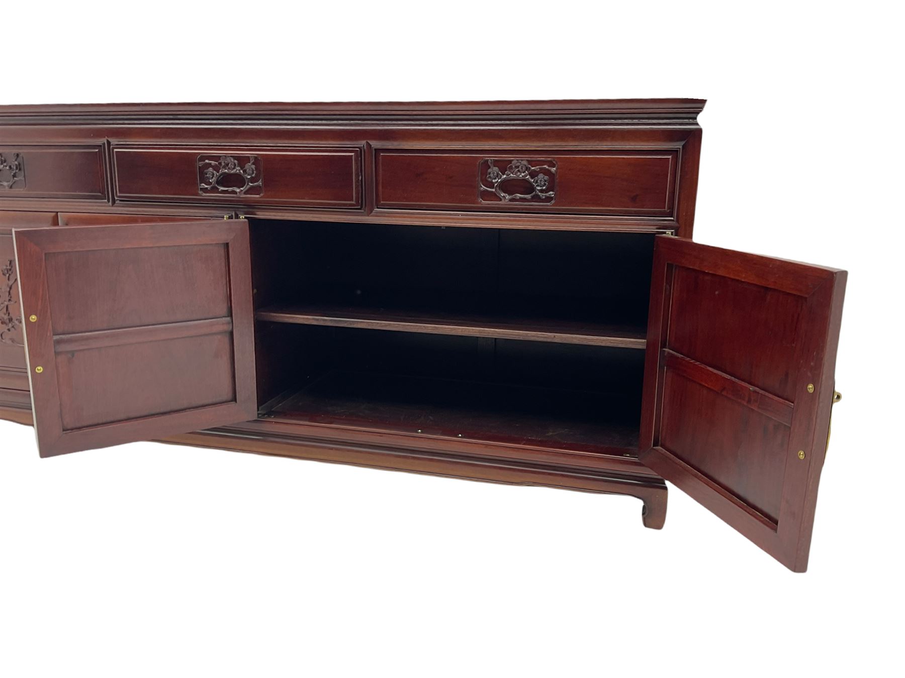 Chinese hardwood sideboard, three drawers above four cupboards, the doors relief carved with flowers and birds 