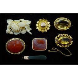 Two Victorian gold citrine brooches, two banded agate brooches, one with etched initials, gold Etruscan revival mourning brooch, Victorian carved ivory flower brooch and   a gold mounted jade pendant