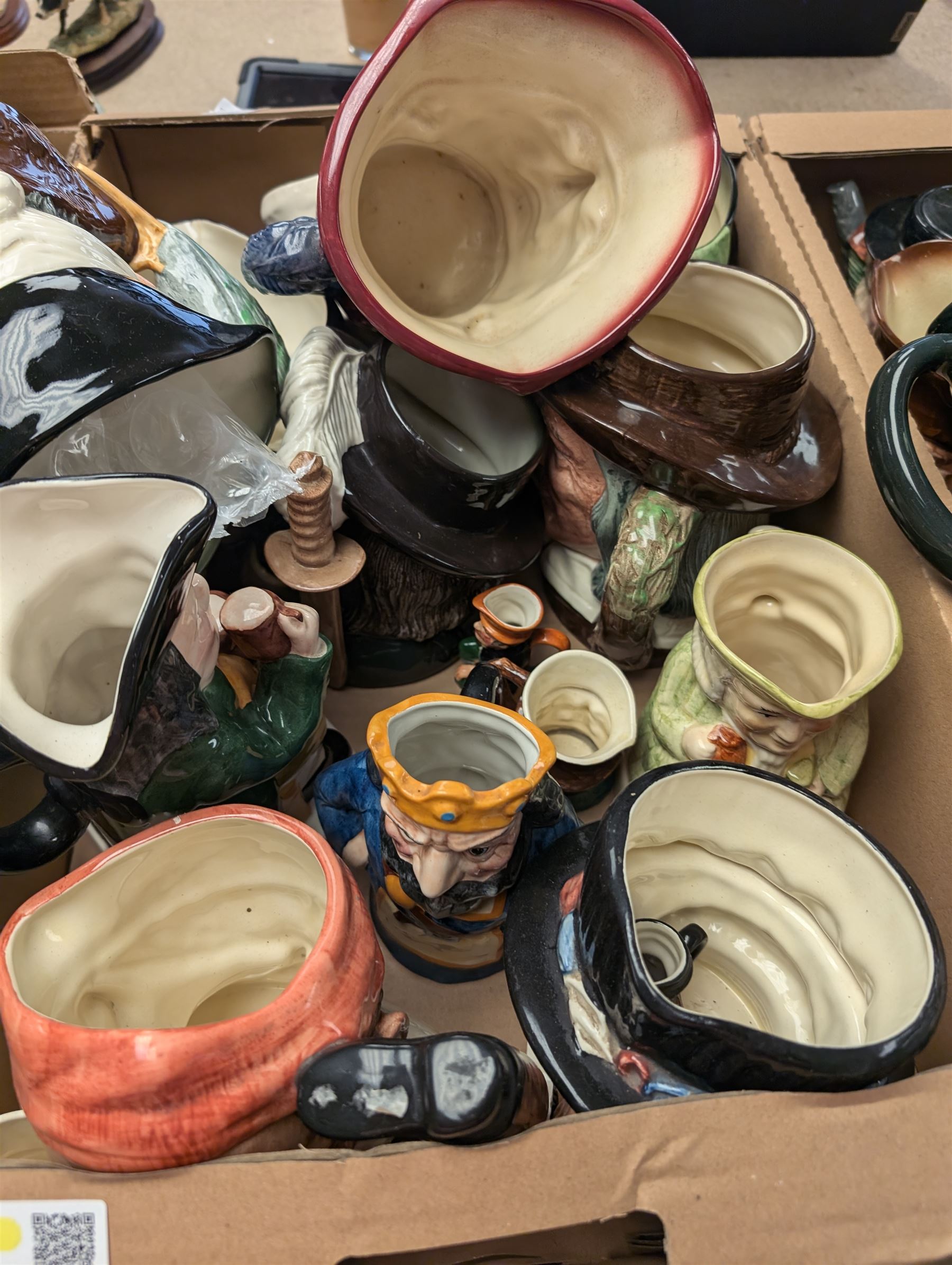 Collection of character and toby jugs and teapots, mostly Royal Doulton examples, in three boxes 