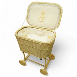 *Mid 20th century nursery set, comprising a cream painted metal cot with adjustable base, a wicker baby basket on wheeled stand, and a folding nursery screen with printed fabric panels decorated with playful animal and teddy bear motifs

Cot (H 112cm, W 136cm, D 77cm)
Screen (H 139cm, W 148cm) 
Basket (H 72cm, W 59cm, D 40cm)From the Kirkham Hall Attic & Cellar Collection, sold without reserve