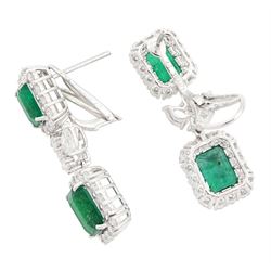 Pair of 18ct white gold emerald and diamond earrings, each stud set with two octagonal cut emeralds, with round brilliant cut diamonds, spaced by two pear cut diamonds and two further round brilliant cut diamonds, stamped, total emerald weight approx 4.85 carat, total diamond weight approx 2.85 carat