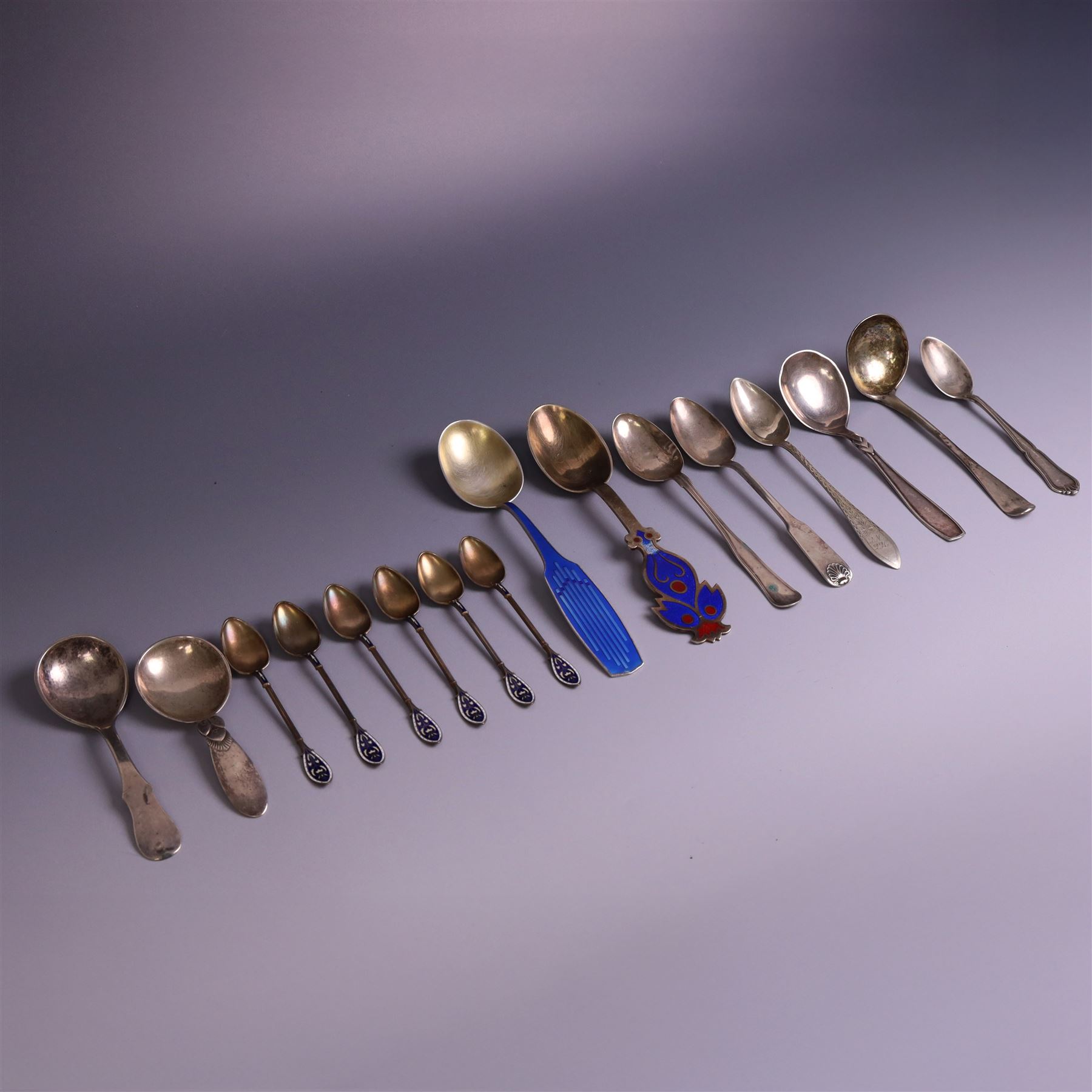 Collection of continental silver spoons, including set of six enamel demitasse spoons, stamped 925 and two enamel year spoons one by Arne Hansen, the other by Anton Michelsen