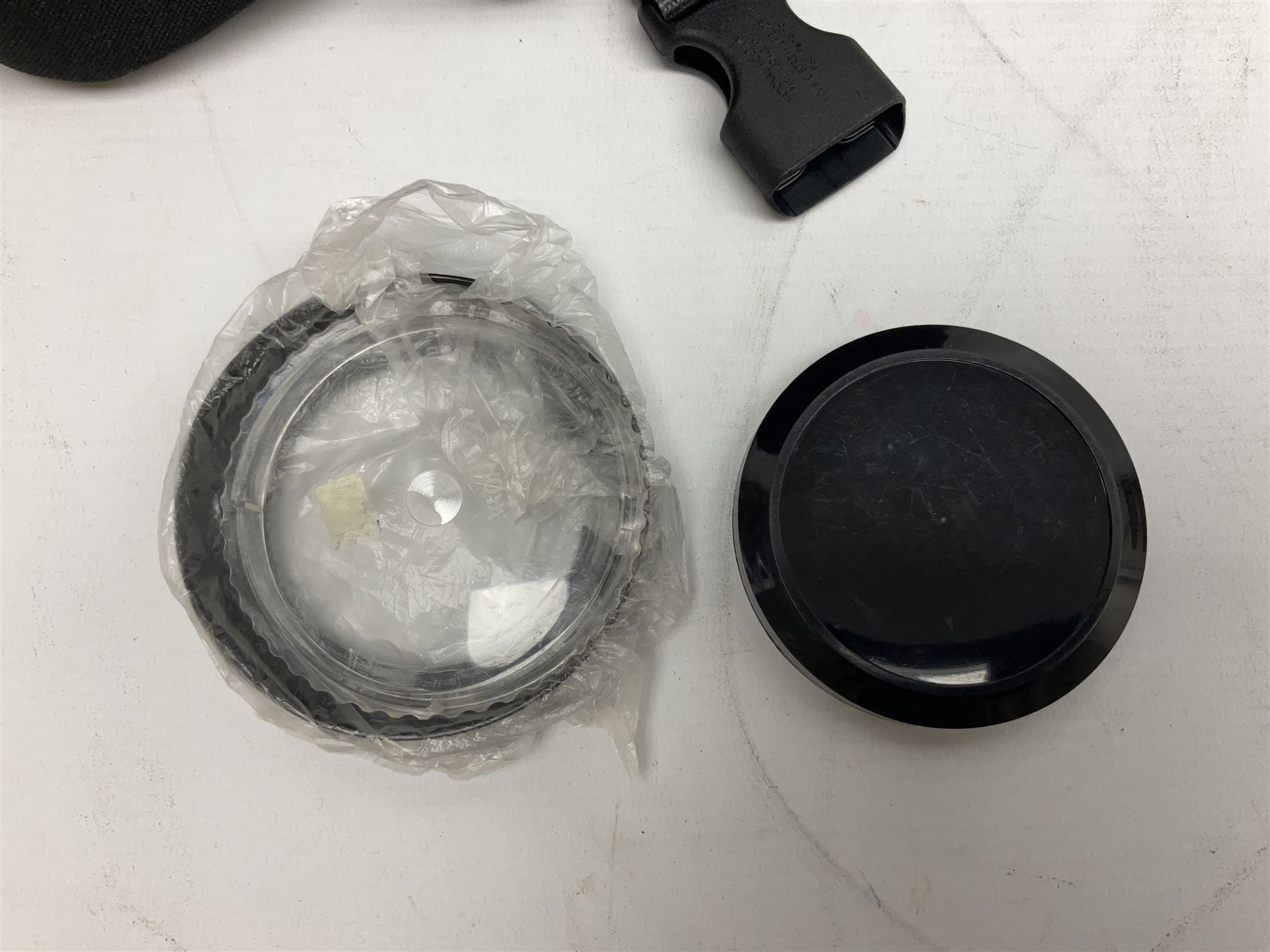 Nikon F3 SLR camera, serial number 1583609; Nikon 50mm 1:1.8 lens; Nikon 28-85mm 1:3.5-4.5 zoom lens; Vivitar MC 2X-3 Tele Converter, and a Nikon Speedlight SB-16 flash