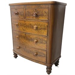 Victorian mahogany bow-front chest, fitted with two short and three long cock-beaded drawers with turned handles, on turned feet