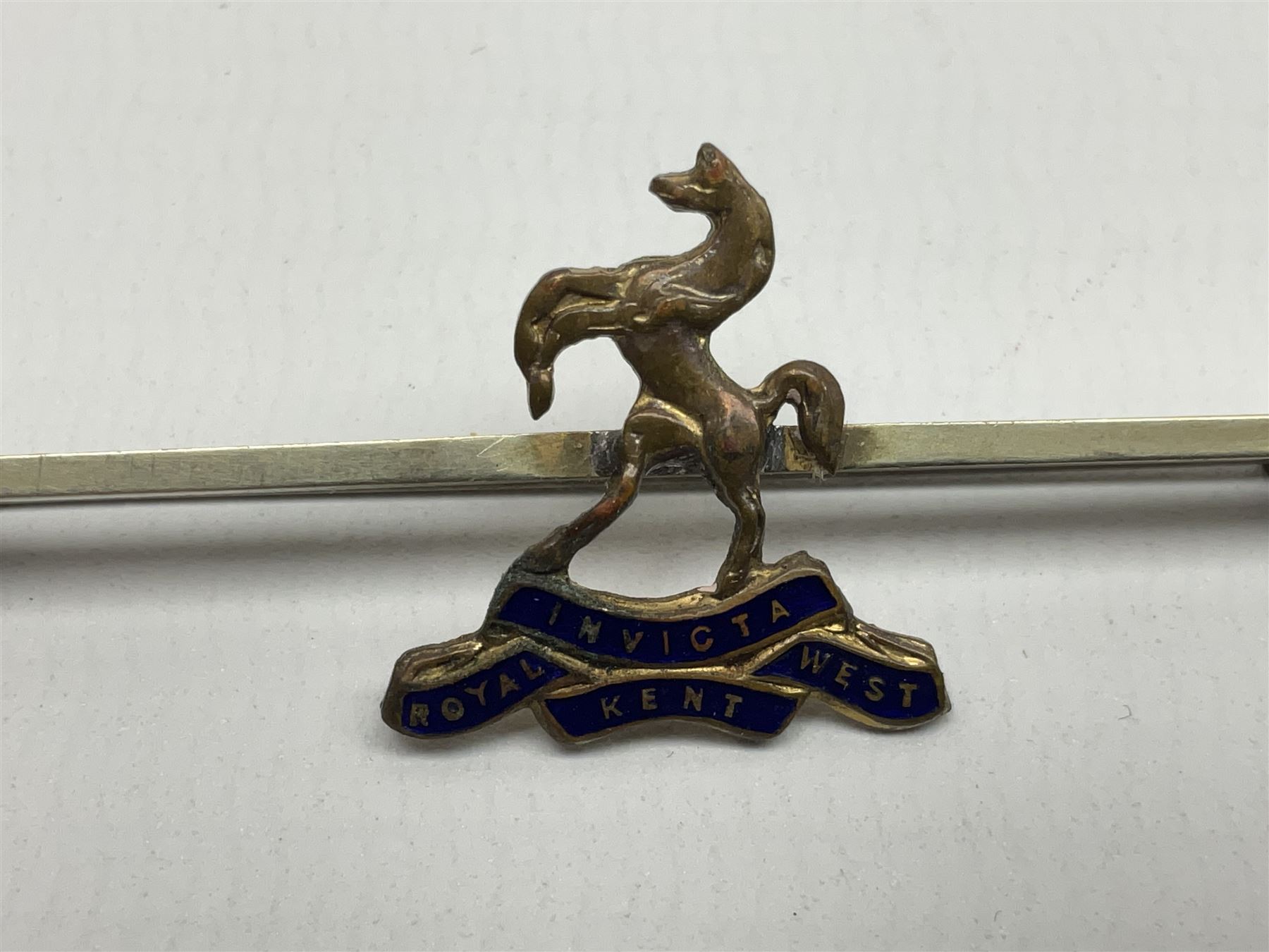 Royal West Kent regiment 9ct gold and enamel sweetheart brooch; The Queens Own regiment silver and enamel sweetheart brooch; and another sweetheart brooch for the Royal West Kent regiment (3)