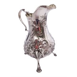Victorian silver cream jug, of bellied form with scroll handle, the body embossed with flower heads and acanthus leaves, upon thee foot feet, hallmarked Beare Falcke, London 1873, H12.5cm, approximate weight 4.09 ozt (127.5 grams)