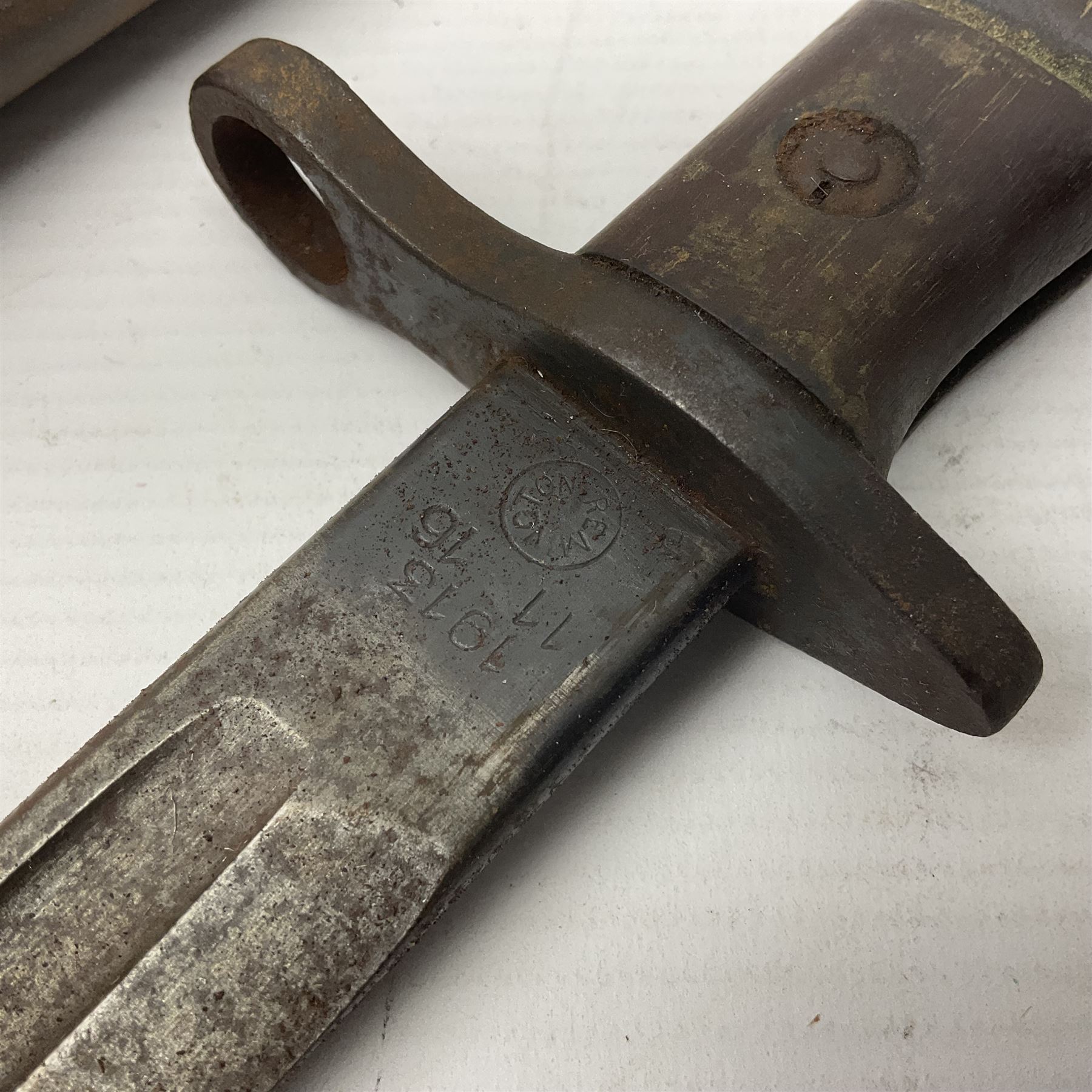 WWI Remington Pattern 1913 bayonet, the 43cm fullered blade with various marks to the ricasso including date code 11 16; in leather covered scabbard with various stamps including JWB 17 L58cm overall; and a French Model 1866 sabre bayonet (no scabbard)