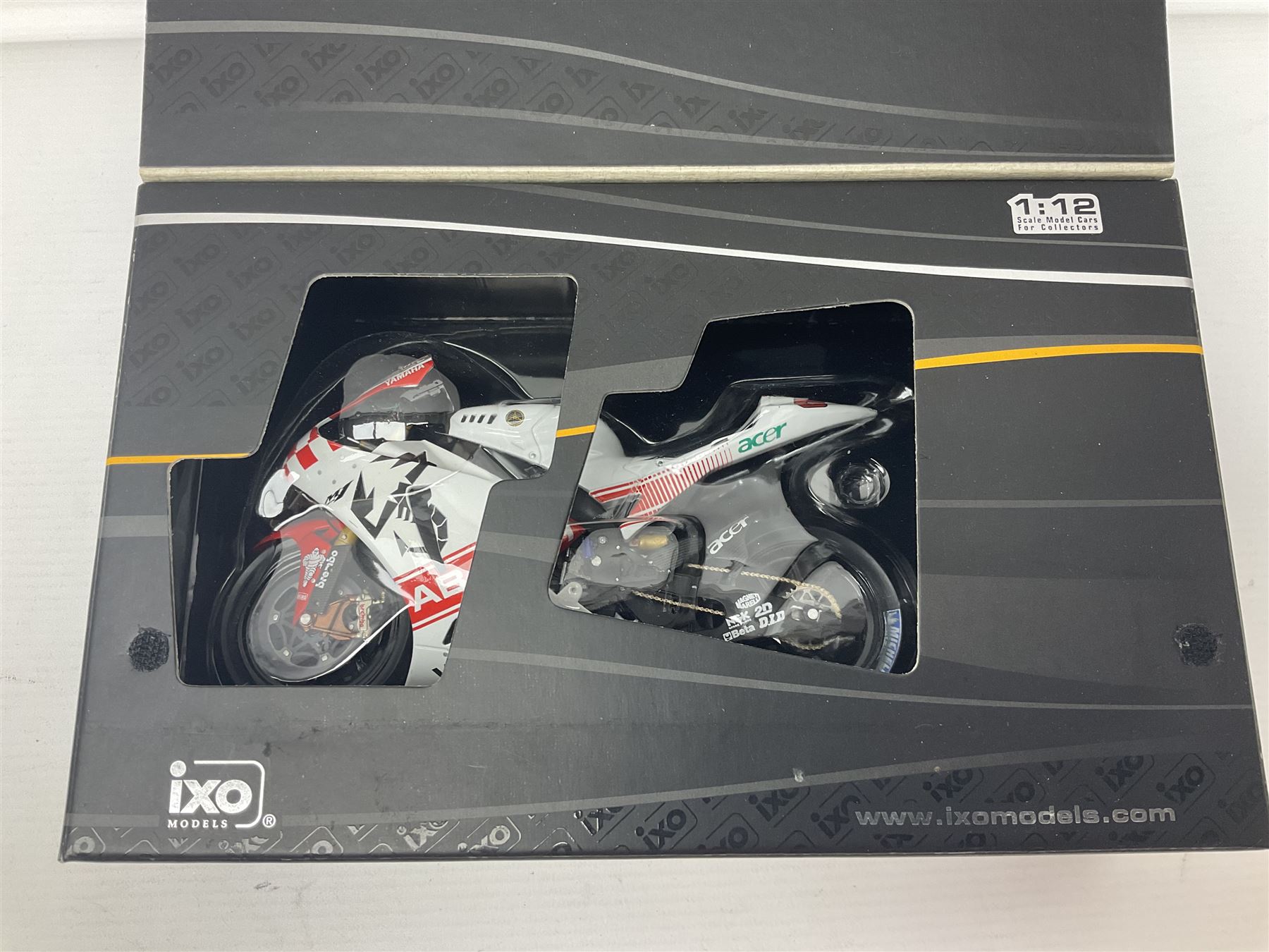 Three Ixo Models 1:12 scale die-cast models of motorcycles - BRB007 Honda NSR500 Michael Doohan 1998; BRB001 Honda RC211V Valentino Rossi 2003; and Yamaha YZR-M1 Colin Edwards MotoGP Phillip Island 2007; all boxed (3)