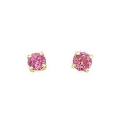 Pair of 9ct gold round cut garnet stud earrings, stamped
