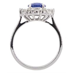 18ct white gold oval sapphire and tapered baguette and round brilliant cut diamond cluster ring, stamped 750, sapphire approx 1.60 carat, total diamond weight approx 0.50 carat